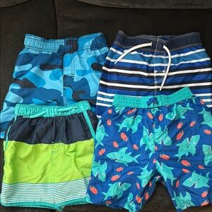 4 pairs of swim trunks